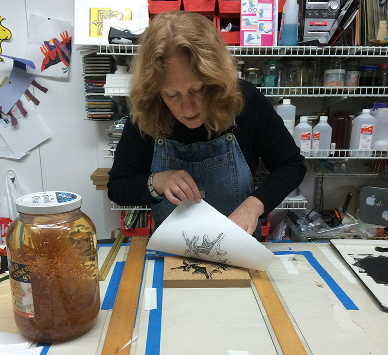 Kathy Strauss pulling a print